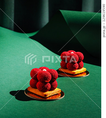 Exquisite desserts showcased on a vibrant green background with texture Exquisite desserts showcased on a vibrant green background with texture 129619590