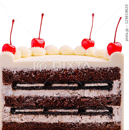 Delicious chocolate cake topped with cherries and whipped cream 129619620