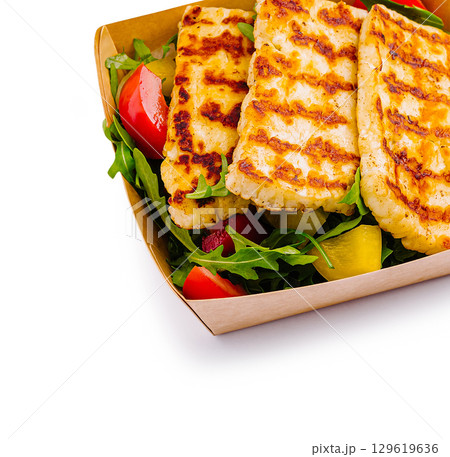 Grilled cheese platter served with fresh salad on a sunny day outdoors Grilled cheese platter served with fresh salad on a sunny day outdoors 129619636