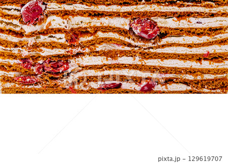 Delicious cranberry spice cake layers with creamy filling displayed 129619707