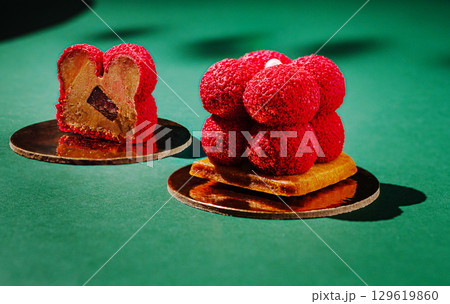 Unique dessert creations with vibrant colors and interesting textures displayed 129619860
