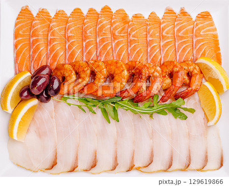 A colorful assortment of fresh seafood arranged beautifully 129619866