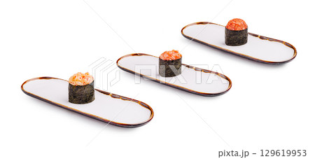 Sushi delicacy presented on a stylish plate in a modern setting Sushi delicacy presented on a stylish plate in a modern setting 129619953