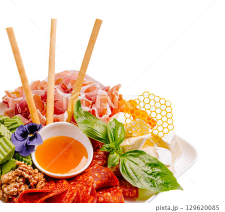 Beautiful gourmet platter of assorted meats, cheeses, and honeycomb 129620085