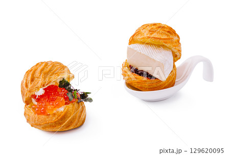 Gourmet puff pastry filled with caviar and soft cheese on white background Gourmet puff pastry filled with caviar and soft cheese on white background 129620095