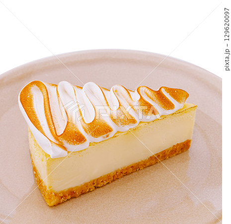 Delicious slice of creamy lemon meringue pie on a neutral plate Delicious slice of creamy lemon meringue pie on a neutral plate 129620097