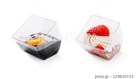 Delightful dessert cups featuring chocolate mousse and strawberry shortcake Delightful dessert cups featuring chocolate mousse and strawberry shortcake 129620133