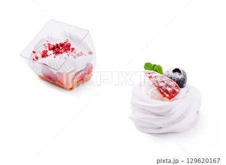 Two beautifully crafted desserts are presented side by side 129620167