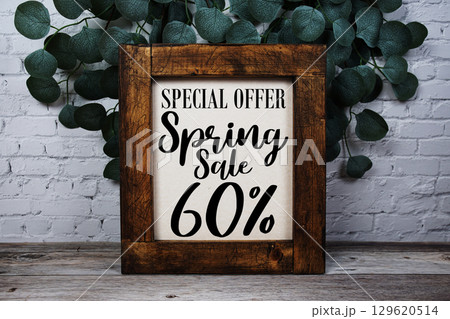 Spring Sale 60% Promotion and Marketing on wooden background 129620514