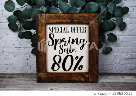 Spring Sale 80% Promotion and Marketing on wooden background 129620515