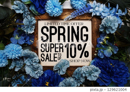 Spring Sale 10% Promotion and Marketing with flowers bouquet decoration on wooden background 129621004
