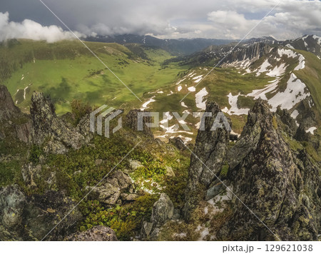 Magnificent mountain landscape, green valley Magnificent mountain landscape, green valley 129621038