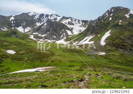 mountain valley with a stream 129621042