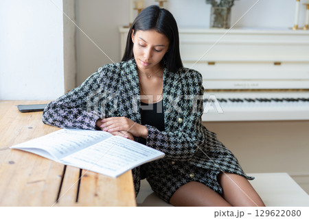 Music college student learning sheet music Music college student learning sheet music 129622080