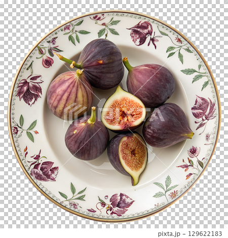 Fresh ripe figs arranged on decorative ceramic plates, mediterranean fruit display isolated on transparent background 129622183