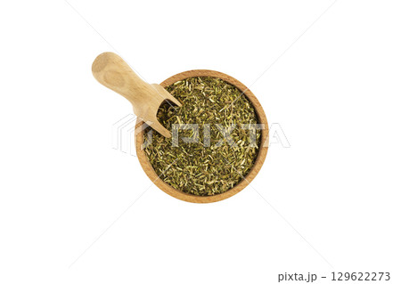 passion flower herb in latin - passiflora incarnata in wooden bowl and scoop isolated on white background. Medicinal herb. 129622273