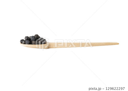 Dried Prunus spinosa, called blackthorn or sloe on wooden spoon isolated on white background. Dried Prunus spinosa, called blackthorn or sloe on wooden spoon isolated on white background. 129622297