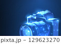 Camera. Abstract 3d polygonal wireframe modern professional camera isolated on blue. 129623270