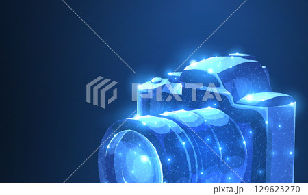 Camera. Abstract 3d polygonal wireframe modern professional camera isolated on blue. 129623270