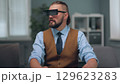 A man is watching holographic screens. 129623283