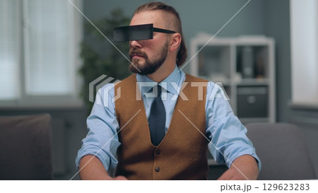A man is watching holographic screens. A man is watching holographic screens. 129623283