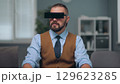 A man is watching holographic screens. 129623285