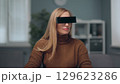A woman is watching holographic screens. 129623286