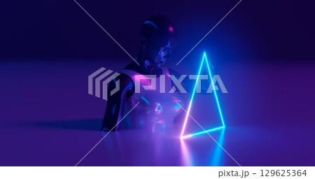 3d rendering. A Moniken girl from a darkly glossy matyal, dressed in bright glossy clothes, holds a glowing neon triangle with her finger on a flat surface. On a deep blue background. 129625364