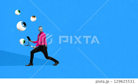Graphic composition. Man in pink shirt playing tennis with flying eyeballs while holding laptop Graphic composition. Man in pink shirt playing tennis with flying eyeballs while holding laptop 129625531