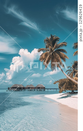 Tranquil beach with palm tree and overwater bungalows under a clear blue sky by the ocean, sandy shore with calm turquoise waters stretching to the horizon 129626419