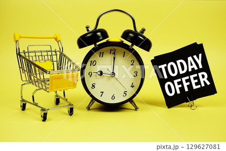 Today Offer text message on sticky note with trolley shopping cart and alarm clock on yellow background Today Offer text message on sticky note with trolley shopping cart and alarm clock on yellow background 129627081