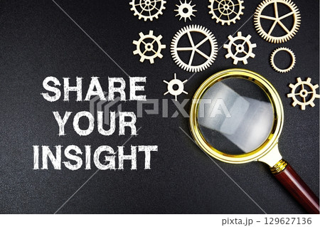 Share Your Insight text message with magnifying glass on black background Share Your Insight text message with magnifying glass on black background 129627136
