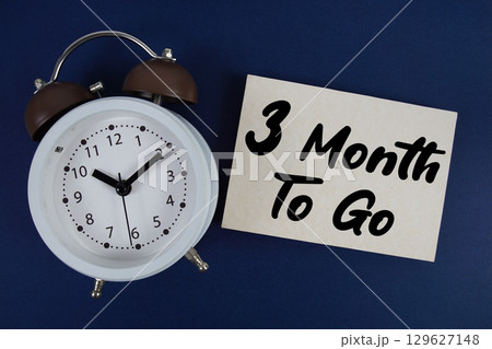 3 Month To Go text written on paper with alarm clock on blue background 3 Month To Go text written on paper with alarm clock on blue background 129627148