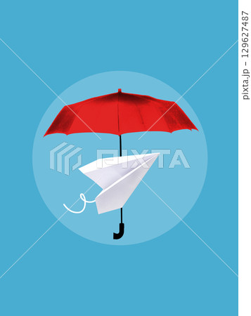 Minimalist pop art collage. Paper plane under red umbrella on blue background 129627487