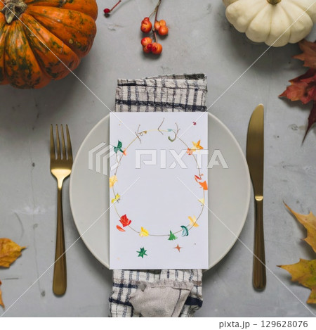 Festive Autumn Table Setting with Pumpkins and Fall Leaves Decoration 129628076