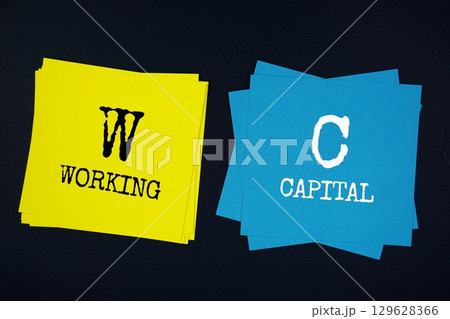 Working Capital (WC) text message on stick note on black background Working Capital (WC) text message on stick note on black background 129628366