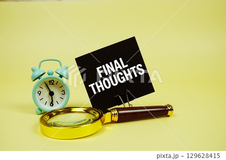 Final Thoughts text message on sticky note with magnifying glass and alarm clock on yellow background Final Thoughts text message on sticky note with magnifying glass and alarm clock on yellow background 129628415