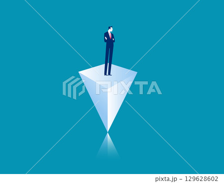 Maintaining balance. Businessman stand on a pyramid 129628602