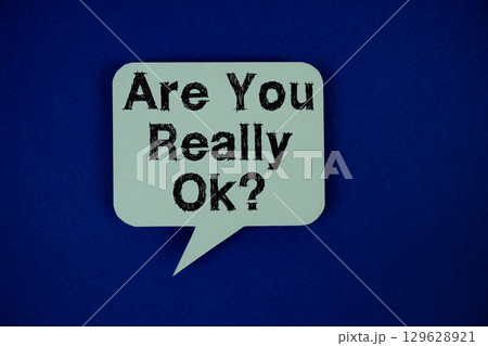 Are You Really Ok? text on speech bubble on navy blue background Are You Really Ok? text on speech bubble on navy blue background 129628921