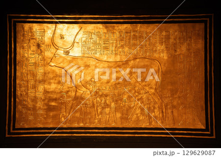 Golden Artwork of Egyptian Cow Goddess Hathor with Ancient Hieroglyphs Golden Artwork of Egyptian Cow Goddess Hathor with Ancient Hieroglyphs 129629087