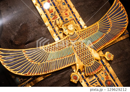 Golden Staff of Goddess Isis on Ancient Egyptian Pharaoh Coffin, divine power. 129629212