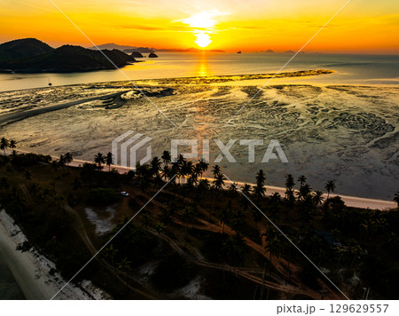 Aerial view sunset sky,Nature beautiful Light Sunset or sunrise over sea,Colorful dramatic majestic scenery sunset Sky with Amazing clouds and waves in sunset sky nature light cloud background 129629557