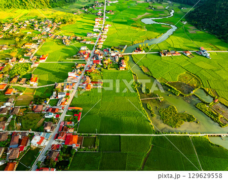Aerial top view of Green rice field at northern vietnam,Beautiful destination in Northern Vietnam,Travel and landscape concept, Nature and rice fields background Aerial top view of Green rice field at northern vietnam,Beautiful destination in Northern Vietnam,Travel and landscape concept, Nature and rice fields background 129629558