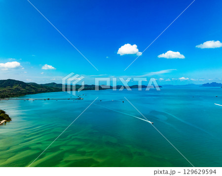 Aerial view of a sea surface water texture background and sun reflections Aerial flying drone view Waves water surface texture on sunny tropical ocean 129629594