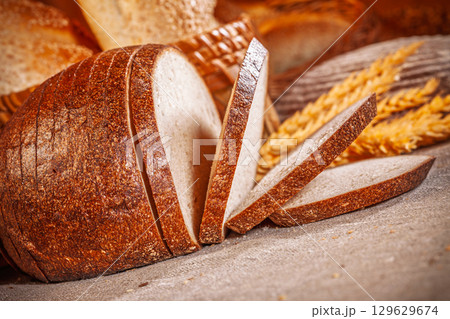 Fresh baked bread. Assorted bakery products loafs of bread and rolls... Fresh baked bread. Assorted bakery products loafs of bread and rolls... 129629674