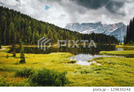Popular high mountain lake Misurina in the Italian Alps. Location place Tre Cime di Lavaredo, Dolomite, South Tyrol, Italy, Europe. Popular high mountain lake Misurina in the Italian Alps. Location place Tre Cime di Lavaredo, Dolomite, South Tyrol, Italy, Europe. 129630248