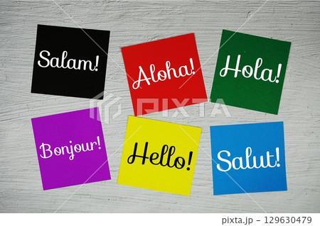 Hello in different languages text on stick note on concrete background Hello in different languages text on stick note on concrete background 129630479