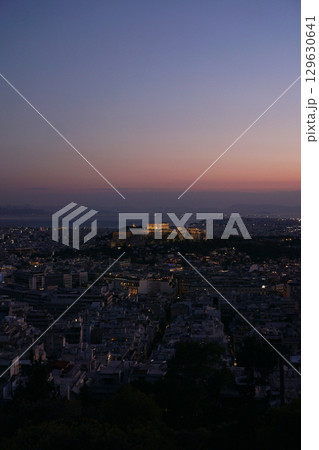 A beautiful twilight view of Athens showcasing the iconic Acropolis skyline is mesmerizing A beautiful twilight view of Athens showcasing the iconic Acropolis skyline is mesmerizing 129630641