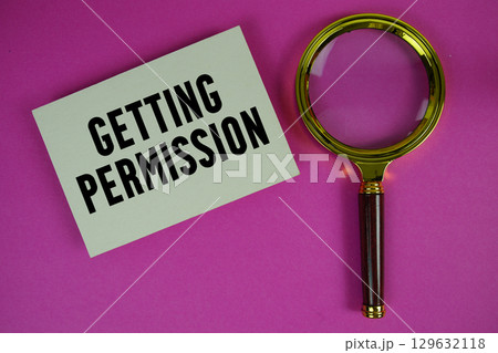 Getting Permission text written on paper with magnifying glass 129632118