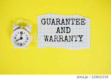 Guarantee And Warranty text written on paper with alarm clock on yellow background Guarantee And Warranty text written on paper with alarm clock on yellow background 129632159